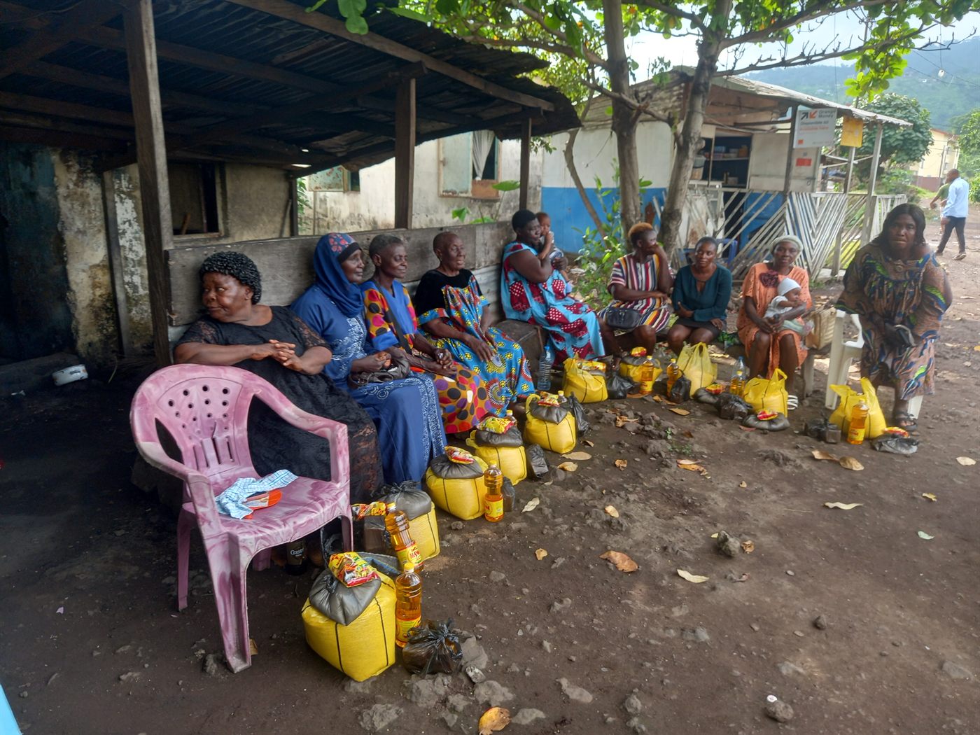 Beneficiaries seated together at an outreach