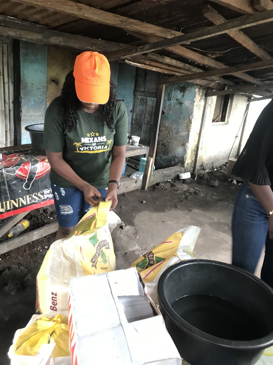 Volunteer preparing bags of rice